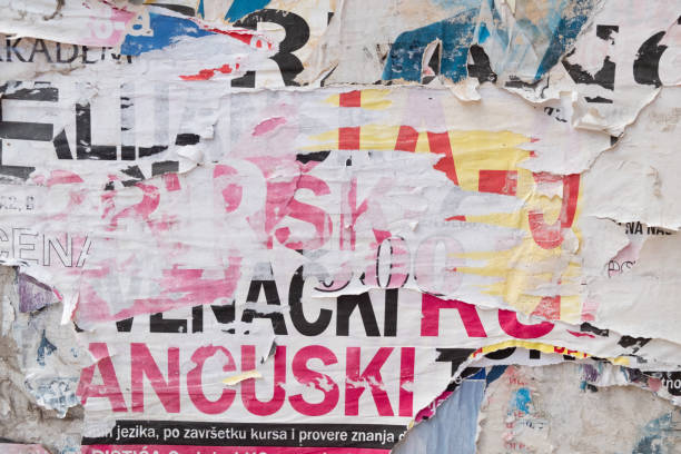 istock Torn and ripped old street poster background 1423556597