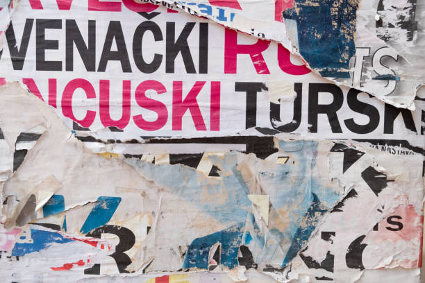 istock Torn and ripped old street poster background 1423556617