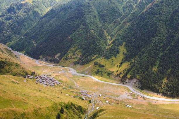 Tusheti mountain landscape and view, high angle, Georgian nature, clouds and forest