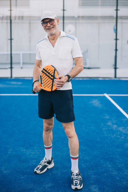 istock Positive senior paddle tennis player 1423558473