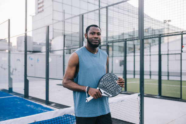 istock Positive paddle tennis player at rooftop court 1423558480