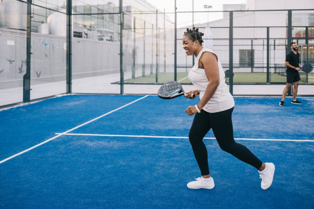 istock Young african woman playing paddle tennis 1423558559