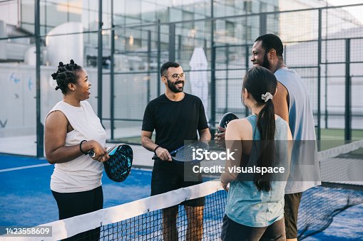 istock Paddle players greeting each other before match 1423558609