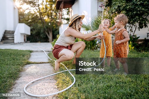 istock Fun times with mother in a backyard 1423561026