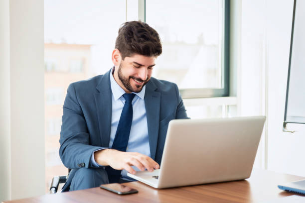 istock Businessman working on laptop in a modern office 1423562836
