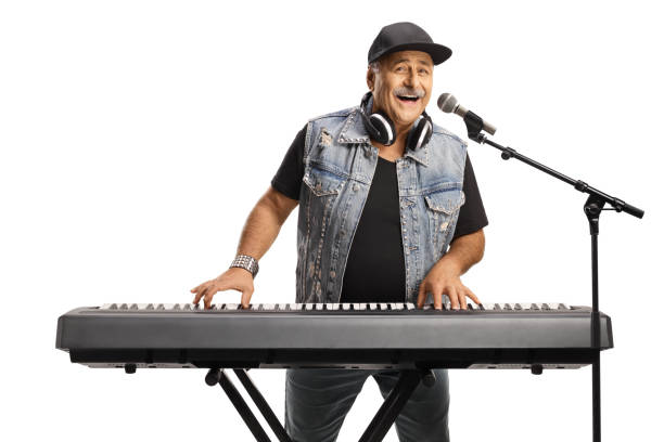 istock Mature man playing a keyboard and singing 1423562928