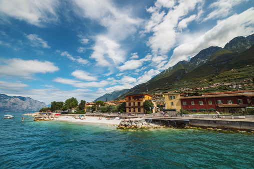 View of Castelletto di Brenzone beach and lakeside from tourboat. Brenzone sul Garda is a comune (municipality) in the Province of Verona in the Italian region of Veneto, located on the eastern shore of Lake Garda about 120 kilometres (75 miles) west of Venice and about 35 km (22 miles) northwest of Verona. Castelletto di Brenzone is one of the frazioni (subdivisions, mainly villages and hamlets) of Brenzone.