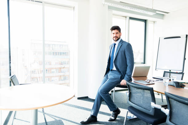 istock Businessman standing in a modern office 1423563173
