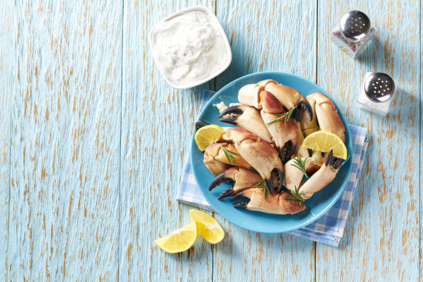 istock Cooked crab on the blue wooden table top view. 1423564382