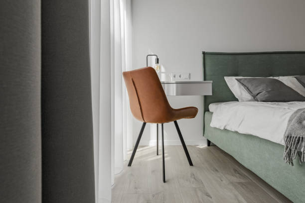 istock Modern minimalistic bedroom interior design with light green bed, eucalyptus in glass vase. Scandinavian style.  Aesthetic simple interior design concept. 1423566570