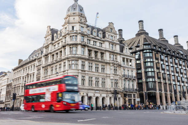 istock Red Bus Driving In Central London 1423566700