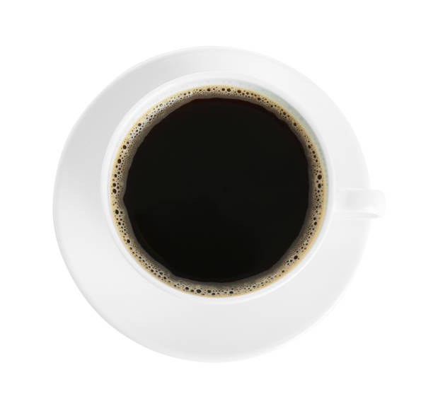 istock Cup of tasty coffee isolated on white, top view 1423566732