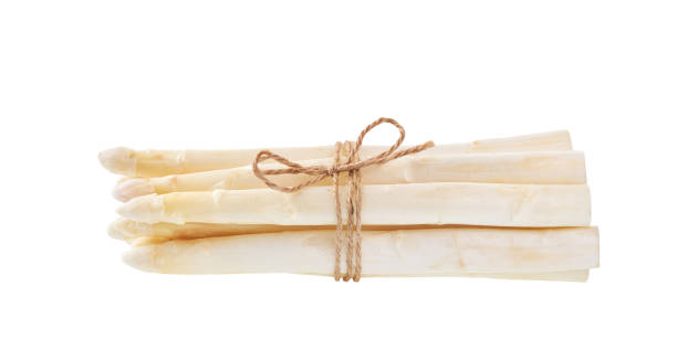istock Fresh white asparagus isolated on white background. 1423568248