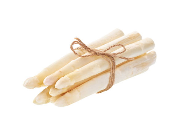 istock Fresh white asparagus isolated on white background. 1423568295