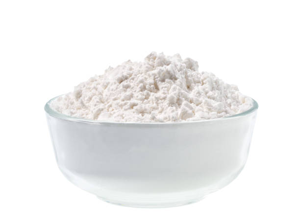 istock Glass plate with potato starch isolated on a white background. 1423568323