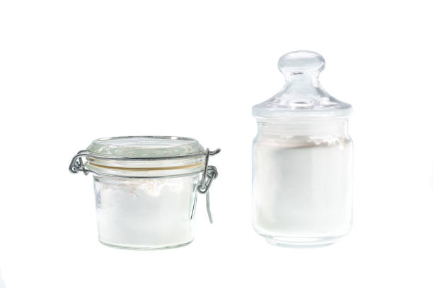 istock Glass jar with corn starch isolated on a white background. 1423568337