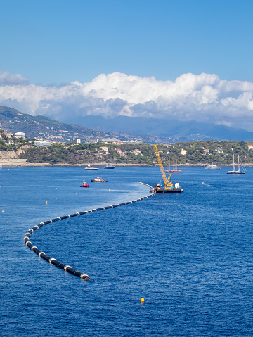 Assembly of a large undersea plastic pipeline to supply cold water to an energy efficient heat pump air conditioning system for a district of Monaco