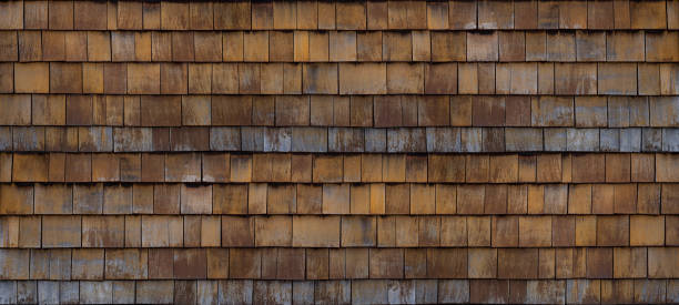 istock Old brown rustic dark wooden shingle wall facade texture - wood background textured pattern 1423569654