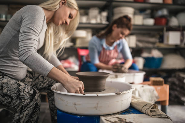 istock Two pottery female artist 1423570887