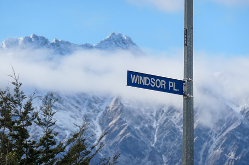 Road signs in the oldest part of Queenstown are named after places in England and Scotland, reflecting the origin of the European settlers. In the background is The Remarkables mountain range.  This image was taken on an early Spring morning.