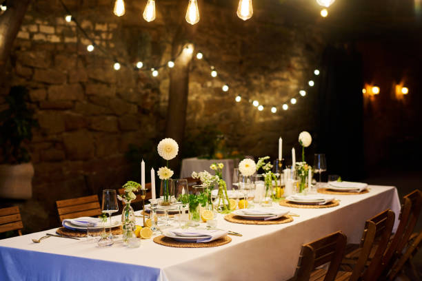 istock Served festive table with plates, wineglasses, decorations and napkins 1423572963