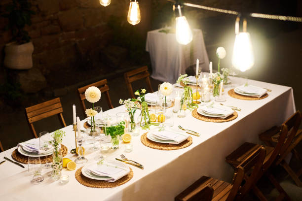 istock Several bright lamps hanging over festive table served for wedding guests 1423572975