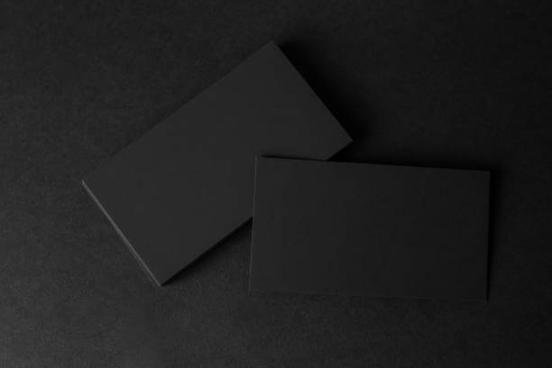istock Blank business cards on black background, flat lay. Mockup for design 1423573362