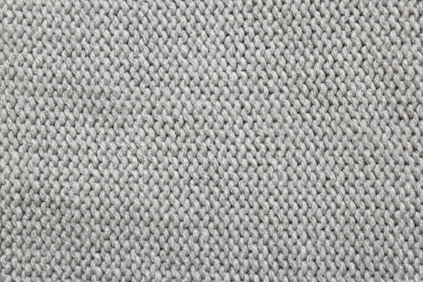 istock Beautiful grey knitted fabric as background, top view 1423573587