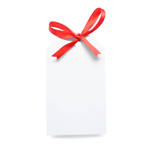 istock Blank gift tag with red satin ribbon on white background, top view 1423574168