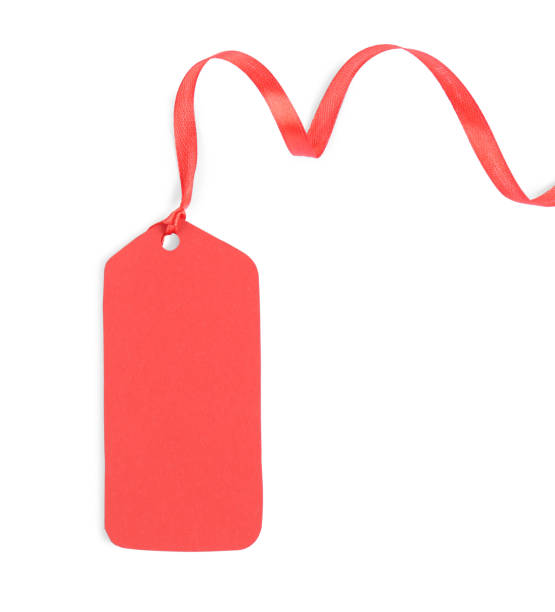 istock Blank red gift tag with satin ribbon on white background, top view 1423574171