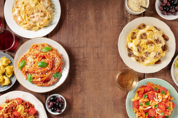 istock Italian pasta dishes forming a frame for copy space, overhead flat lay shot 1423575547