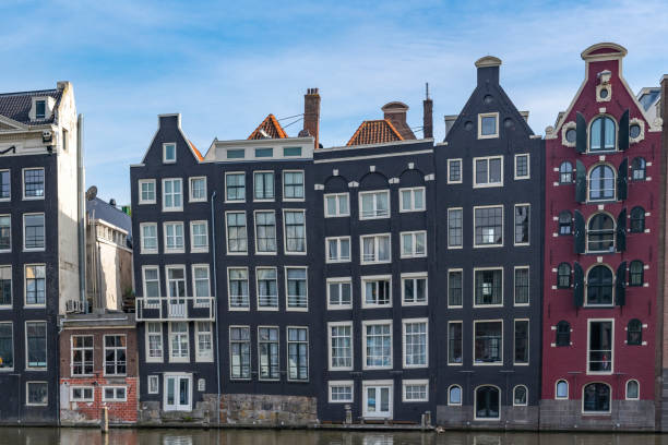 istock Amsterdam downtown canal district during summer 1423575688