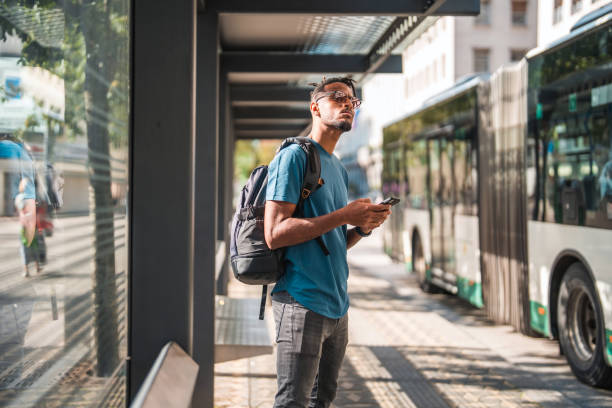istock Cool Young African American Male Using A Smart Phone While Commuting In The City 1423576089