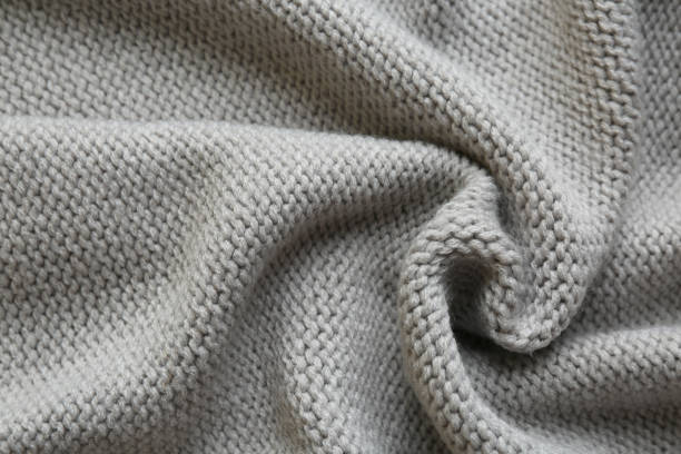 istock Beautiful grey knitted fabric as background, top view 1423576645