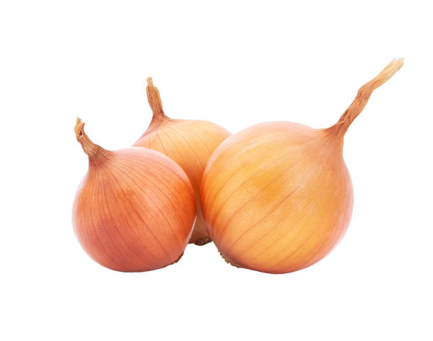 istock fresh raw onions isolated on white background. 1423576897