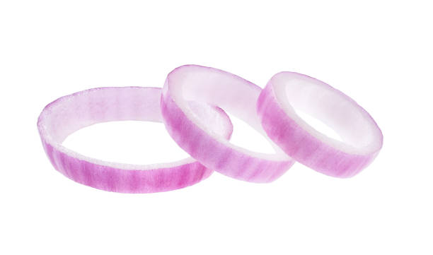 istock Sliced red onion rings isolated on white background. 1423577516