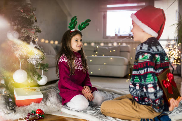 istock Happy children on Christmas Eve 1423577556
