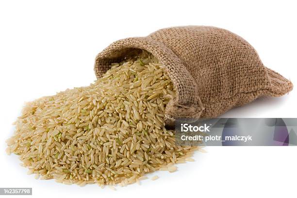 Spilled Burlap Bag Of Brown Rice Stock Photo - Download Image Now - Bag, Brown, Burlap