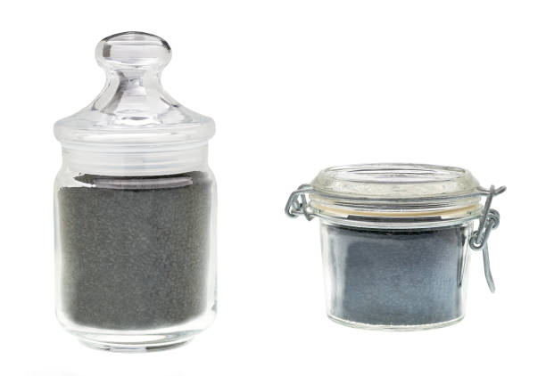 istock Glass jar with black cumin isolated on a white background. 1423579543