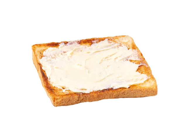 istock toasted bread and butter isolated on white background 1423579655