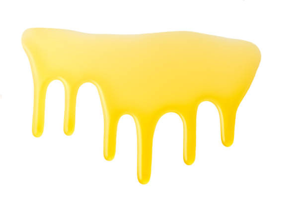 istock natural honey drips down isolated on white background. dripping honey. 1423583983
