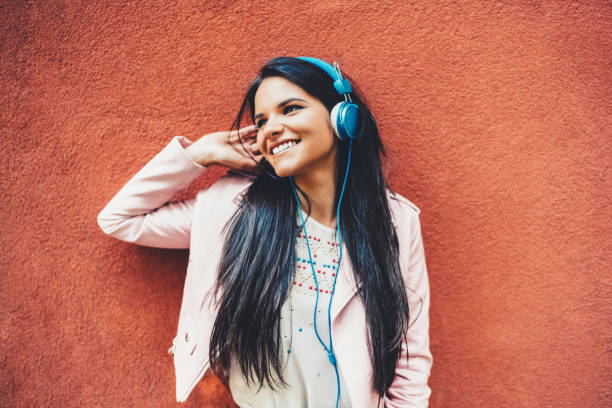 istock Woman dancing to the music 1423587159