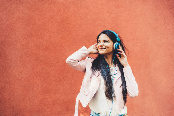 istock Woman dancing to the music 1423587353