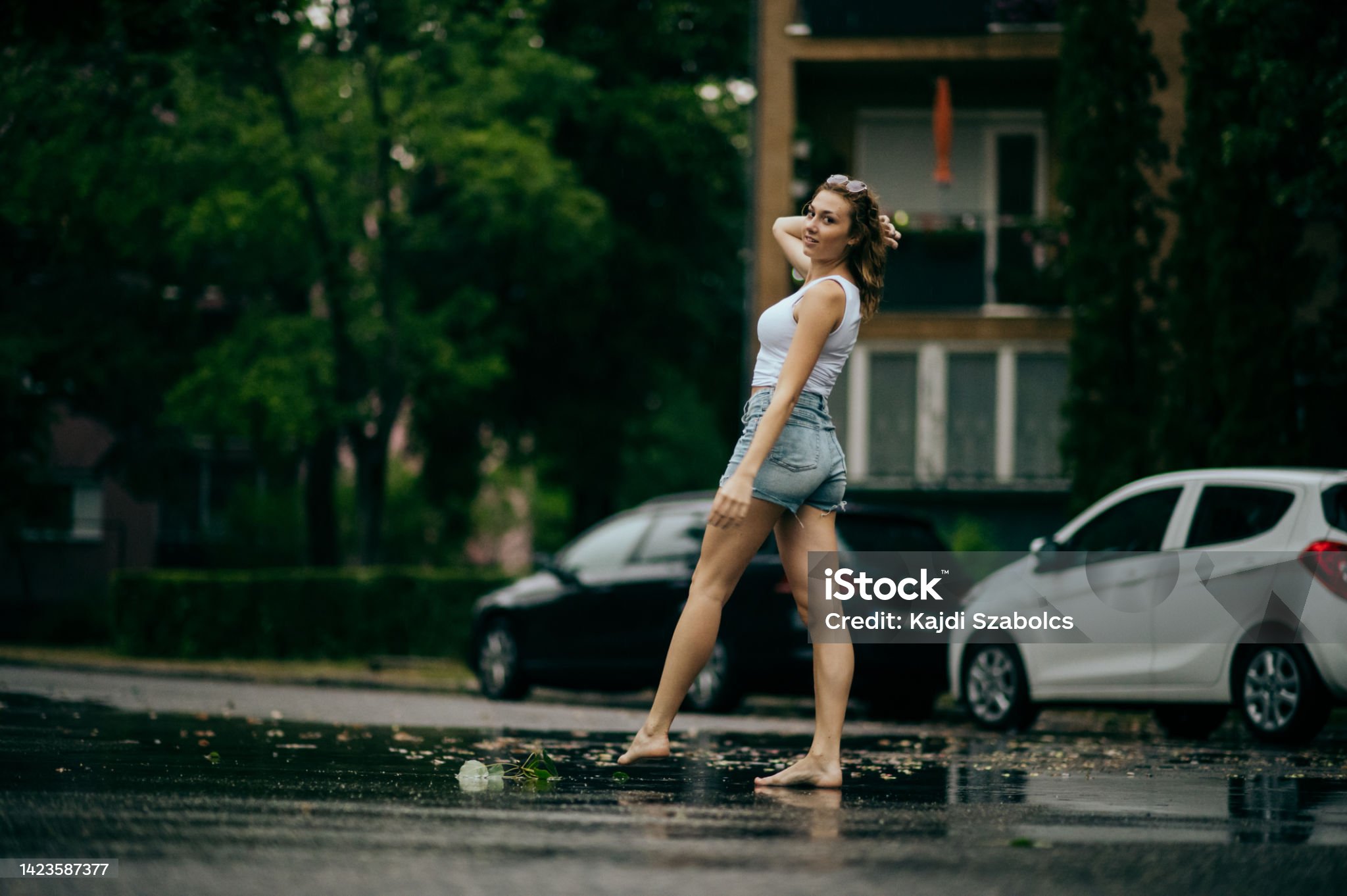 https://media.istockphoto.com/id/1423587377/photo/young-woman-on-steps-in-rain.jpg?s=2048x2048&amp;w=is&amp;k=20&amp;c=FpuN1Avhzp6LghKZDYrKM4woXtYElFMgcCC3-n8NPvI=