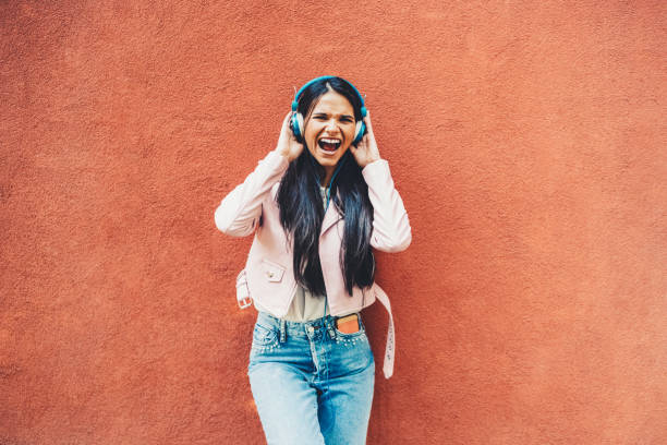 istock Woman dancing to the music 1423587383