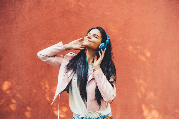 istock Woman dancing to the music 1423587405