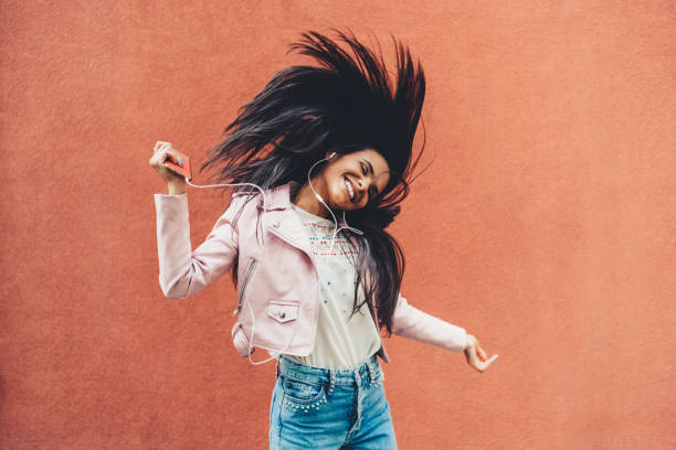istock Woman dancing to the music 1423587465