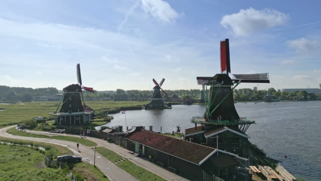 Amsterdam surrounding. Windmills along a Canal