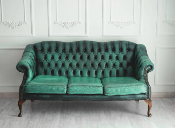 istock Beautiful antique blue sofa on a light background 1423587545