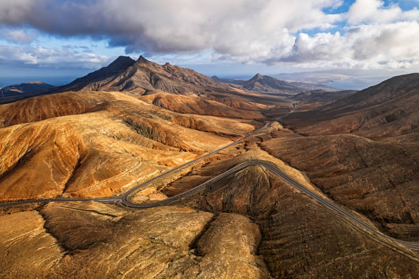 Montana Cardon sunset view from Mirador de Sicasumbre, Fuerteventura island, Spain. Sunset over desert mountains of Fuerteventura, Canary islands, Spain mirador stock pictures, royalty-free photos & images